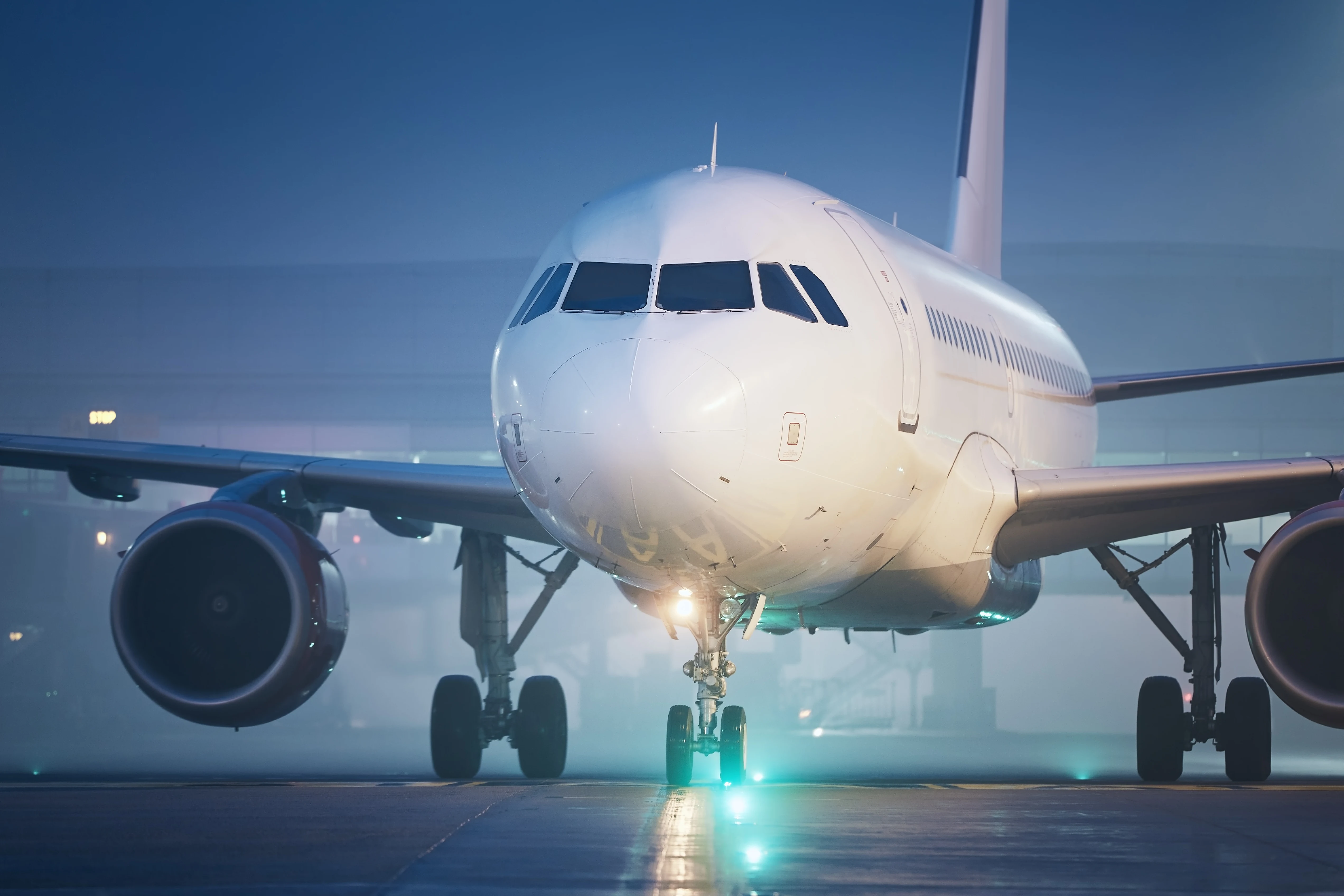 Airliner taxiing at dusk